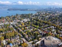 A view of condo buildings, townhouses, and the lake in British Columbia