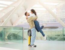 Happy couple reuniting at an airport