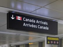 A picture of an arrivals to Canada sign at Pearson International Airport